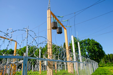 power station behind fence, transformer