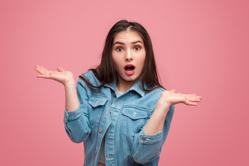 Ignorant expressive girl with hands apart