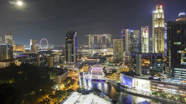  Elevated view over the Entertainment district of Clarke Quay, the Singapore river and City Skyline, South East Asia, Time lapse