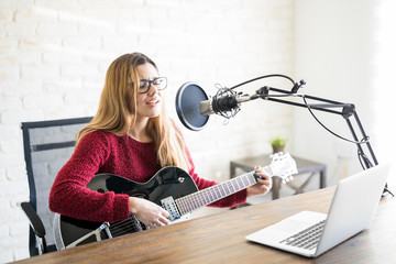 Woman musician broadcasting on an online radio