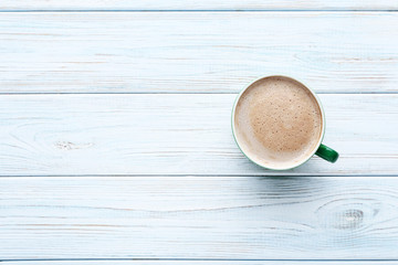 Cup of coffee on wooden table