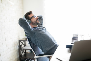 Musician relaxing at home studio