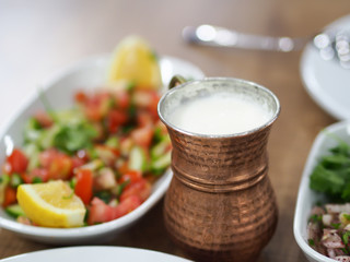 a cup of coffee turkish ayran and turkish dinner table