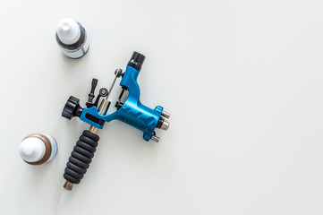 machine for permanent make-up and microblasting on a white background. pigments in small bottles