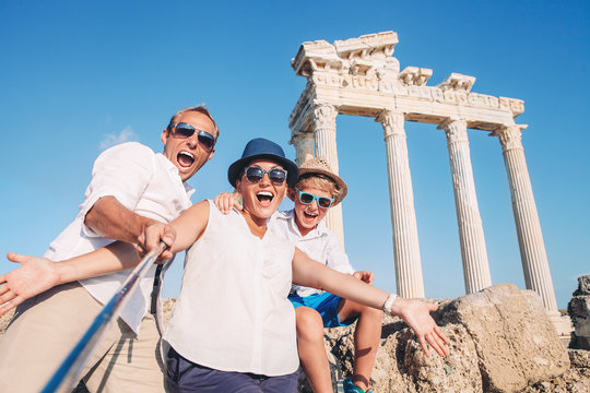 Crazy happy family selfie travel photo on the antique colonnade background. Temple of Apollo,Side,Turkey