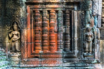 Colorful antient reliefs of Banteay Kdei Temple in Angkor Wat complex in Cambodia
