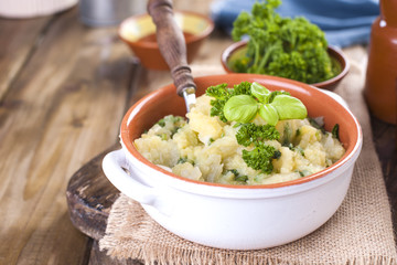 Mashed potatoes in a bowl on a wooden background. Copy space,