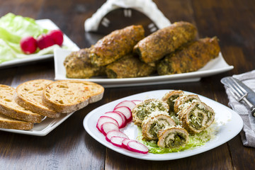 pork roulades stuffed with spinach sprinkled with freshly grated horseradish