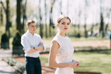 Beautiful young couple in the Park on a Sunny day, loving and happy. Walk and laugh together....