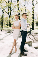 Beautiful young couple in the Park on a Sunny day, loving and happy. Walk and laugh together....