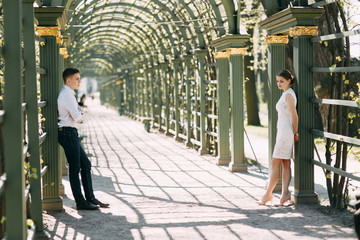 Beautiful young couple in the Park on a Sunny day, loving and happy. Walk and laugh together....