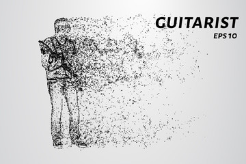 Fototapeta na wymiar Particle guitarist. The guitarist plays the electric guitar