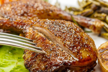 Fried duck legs, ready to serve. The finished dish for use in the restaurant menu.