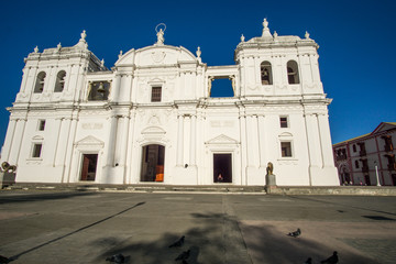Fototapeta premium beautiful view from the church street painted white with a blue sky in the background