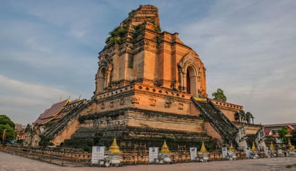 Chiang Mai, Thailand - December 25, 2017: Sunset with the central pagoda of a Buddhist temple