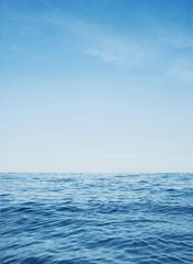 Fotobehang Calm ocean with clear blue water © konradbak