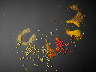 various spices on black background