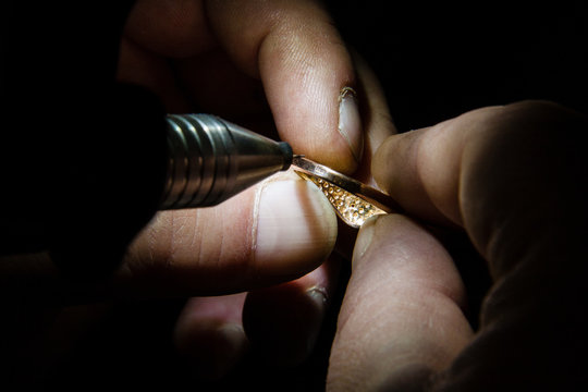 Jeweler makes a piece of jewelry