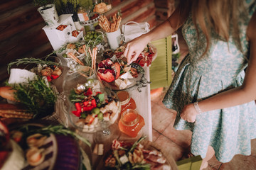 girl takes slice cheese decorated table cakes