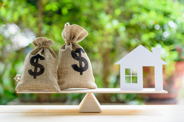 Home loan / reverse mortgage or transforming assets into cash concept : House paper model , US...