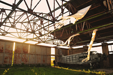 Old light aircraft in an abandoned hangar