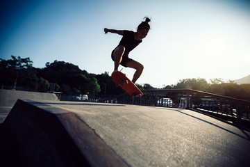 skateboarder skateboarding on skatepark ramp