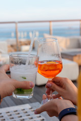 cheers two glasses with cocktails