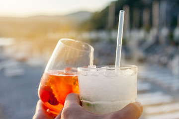 cheers two glasses with cocktails
