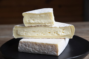 Cheese wedges stacked on plate