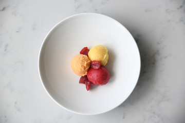Sorbet with raspberries on plate
