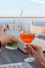 cheers two glasses with cocktails