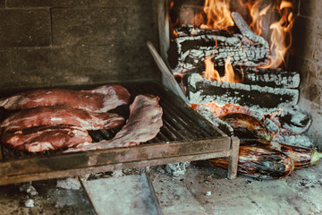 pieces of meat cooking on the grill