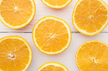 Background of Sliced Oranges on a Wooden Table