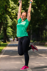 Woman stretching on the running track