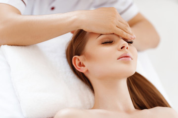 Obraz na płótnie Canvas beautiful girl enjoys massage and spa treatments