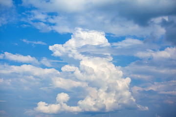 large lush cumulus clouds against a blue sky