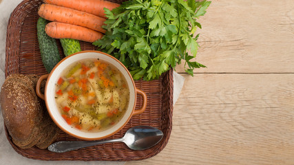 Vegetable soup, surrounded by fresh vegetables. With empty space for writing
