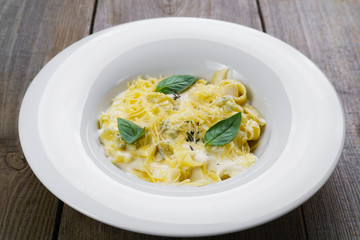 Pasta Fettuccine with blue cheese, bechamel sauce and parmesan. Healthy food, vegetarian meals. Traditional Italian cuisine