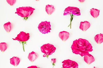 Floral pattern with pink rose flowers and petals on white background. Flat lay, Top view. Flowers texture.