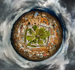 Tiny Planet of Parque Calderon on a stormy day