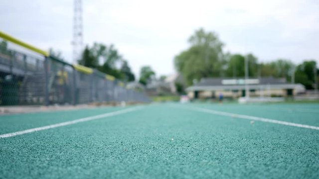 Two women walking on a high school track exercising