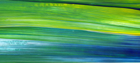 Abstract acrylic painting for use as background, texture, design element. Modern art in Mixed colours of green, blue, yellow.