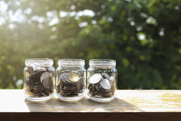 Coins in the glass, Business Finance and Saving growing up concept.