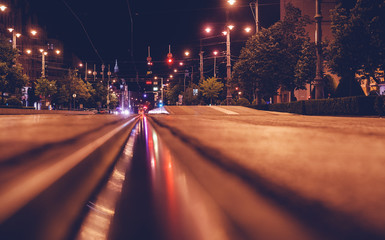 Road in the night city, European city, tram tracks, Debrecen, Hungary