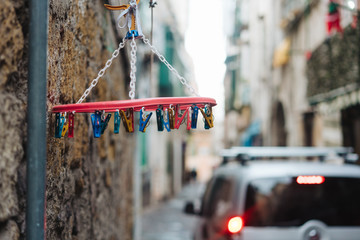 old white plastic clothespins hang