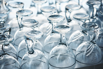 many clean glass inverted ice cream bowls