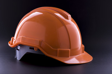 Orange Safety helmet on black background