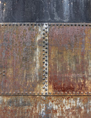 rusty metallic surface with bolt heads