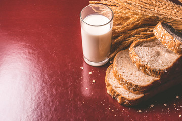 Healthy breakfast with whole wheat bread and milk on the table. copy space