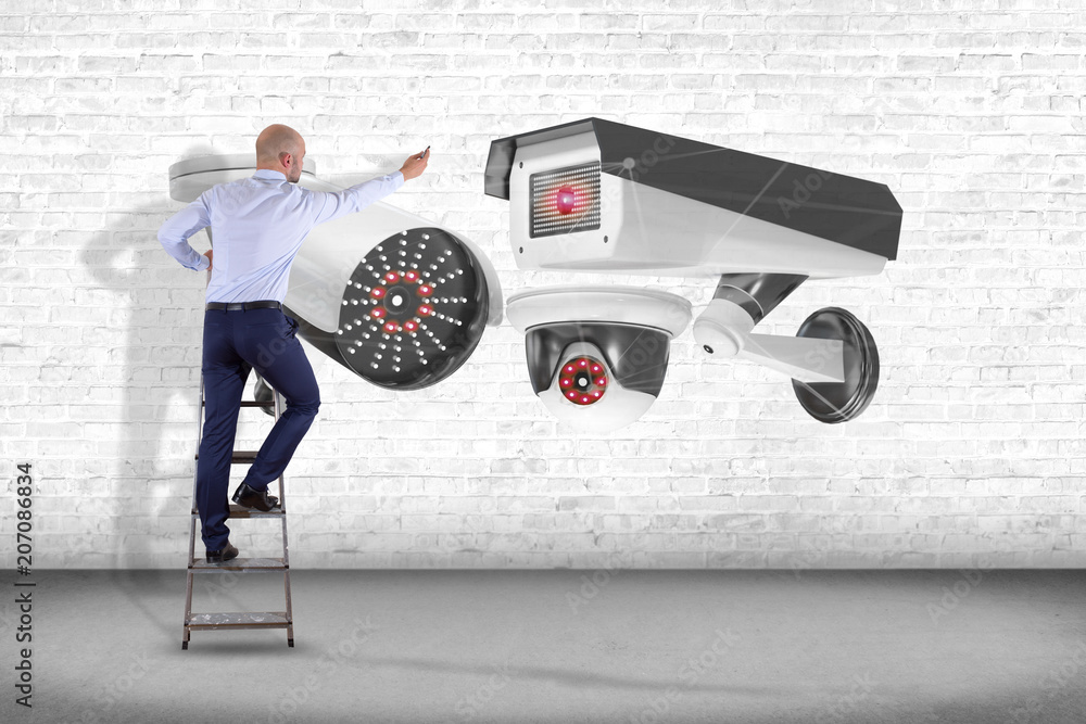 Poster businessman holding a security camera system and network connection - 3d rendering